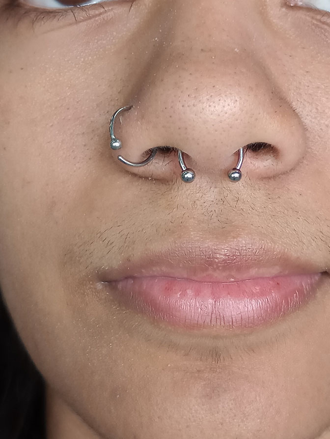 Nostril and double septum ring piercings