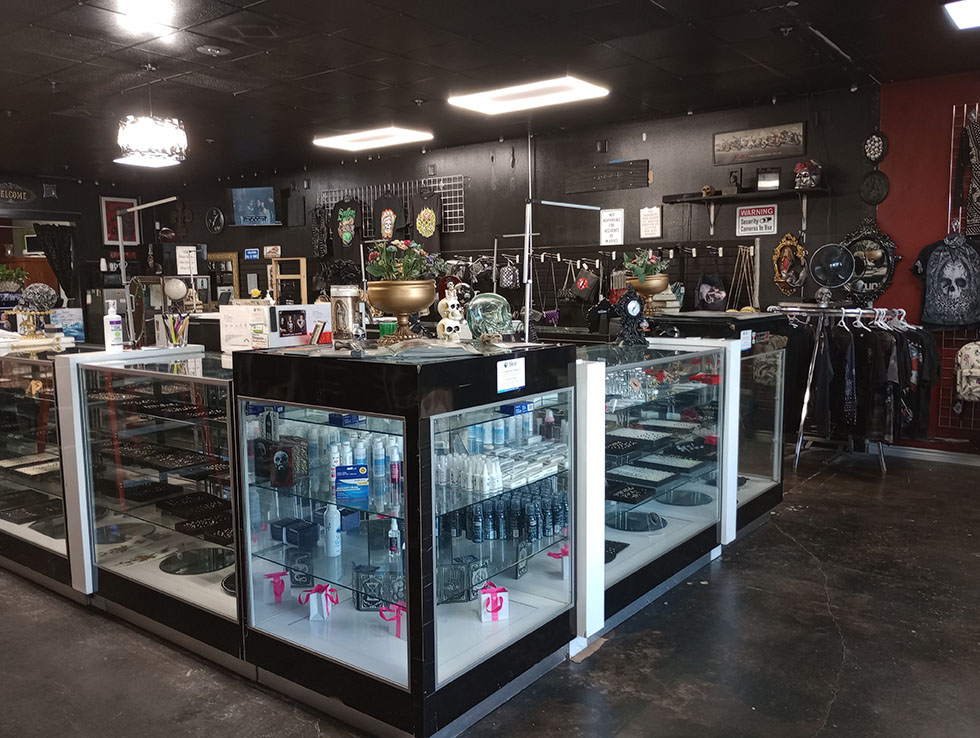 Body jewelry and aftercare display cases in the shop