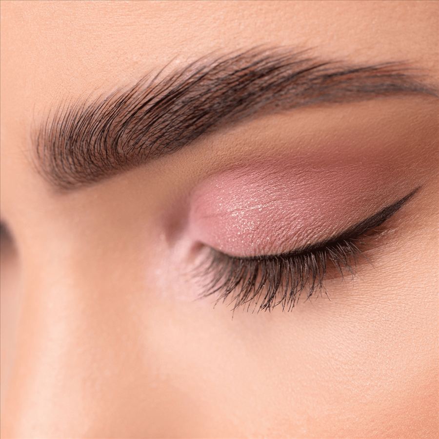 Close-up of defined brows and winged eyeliner